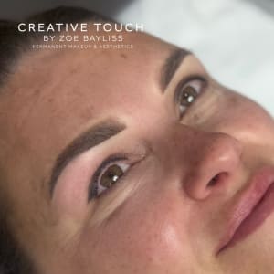 Fresh ombré brows on fair skin showing soft horizontal arch with seamless gradient from darker tail to lighter bulb in medium brown tones