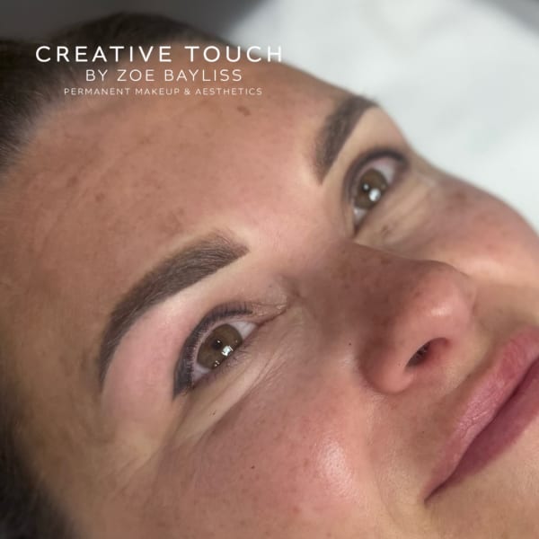 Fresh ombré brows on fair skin showing soft horizontal arch with seamless gradient from darker tail to lighter bulb in medium brown tones