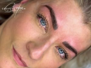 A lovely side-view close-up taken straight after our beautiful client's microblading brows treatment. There is slight redness around the brows following treatment which will go down within a few hours. The brows look highly defined following treatment - brow perfection.