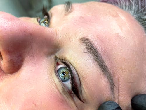 A close-up of a client's eyes showcasing Bottom Liner semi-permanent eyeliner