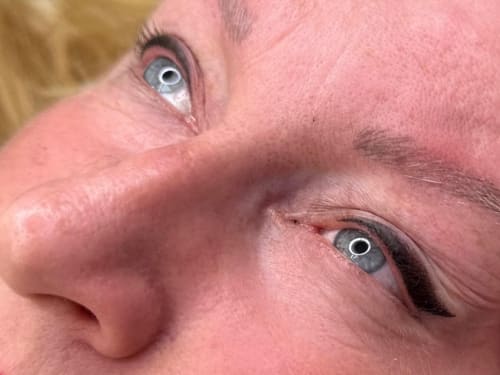 A close-up of a client's eyes showcasing Latino Liner semi-permanent eyeliner
