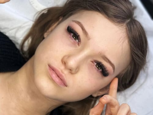 Portrait of a client with medium to mega volume lash extensions